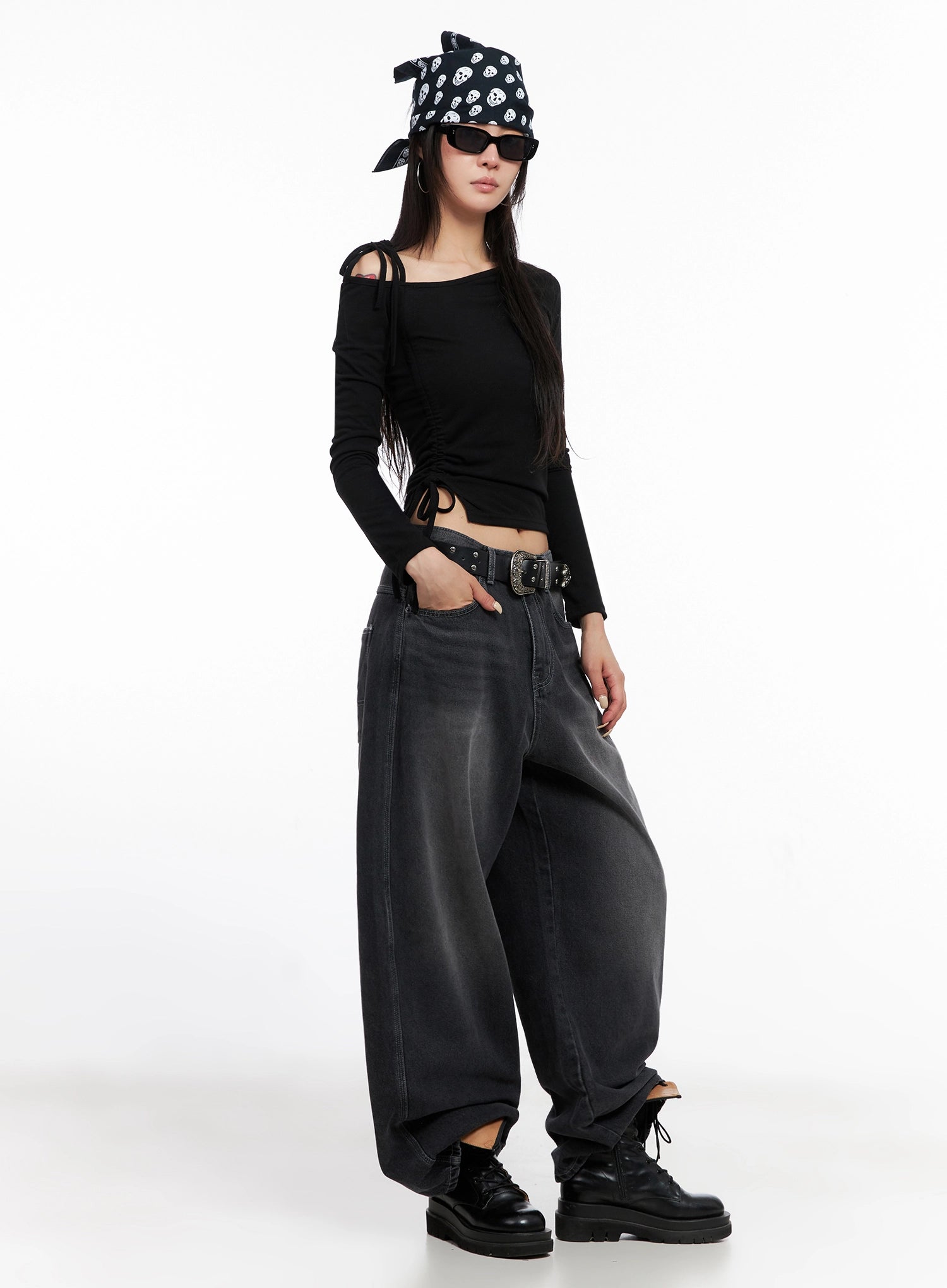 Casual Wide-Leg Baggy Jeans IS515 in Gray, full-length angled front on model, styled street look with studded belt, skull bandana, sunglasses, and chunky lace-up boots.