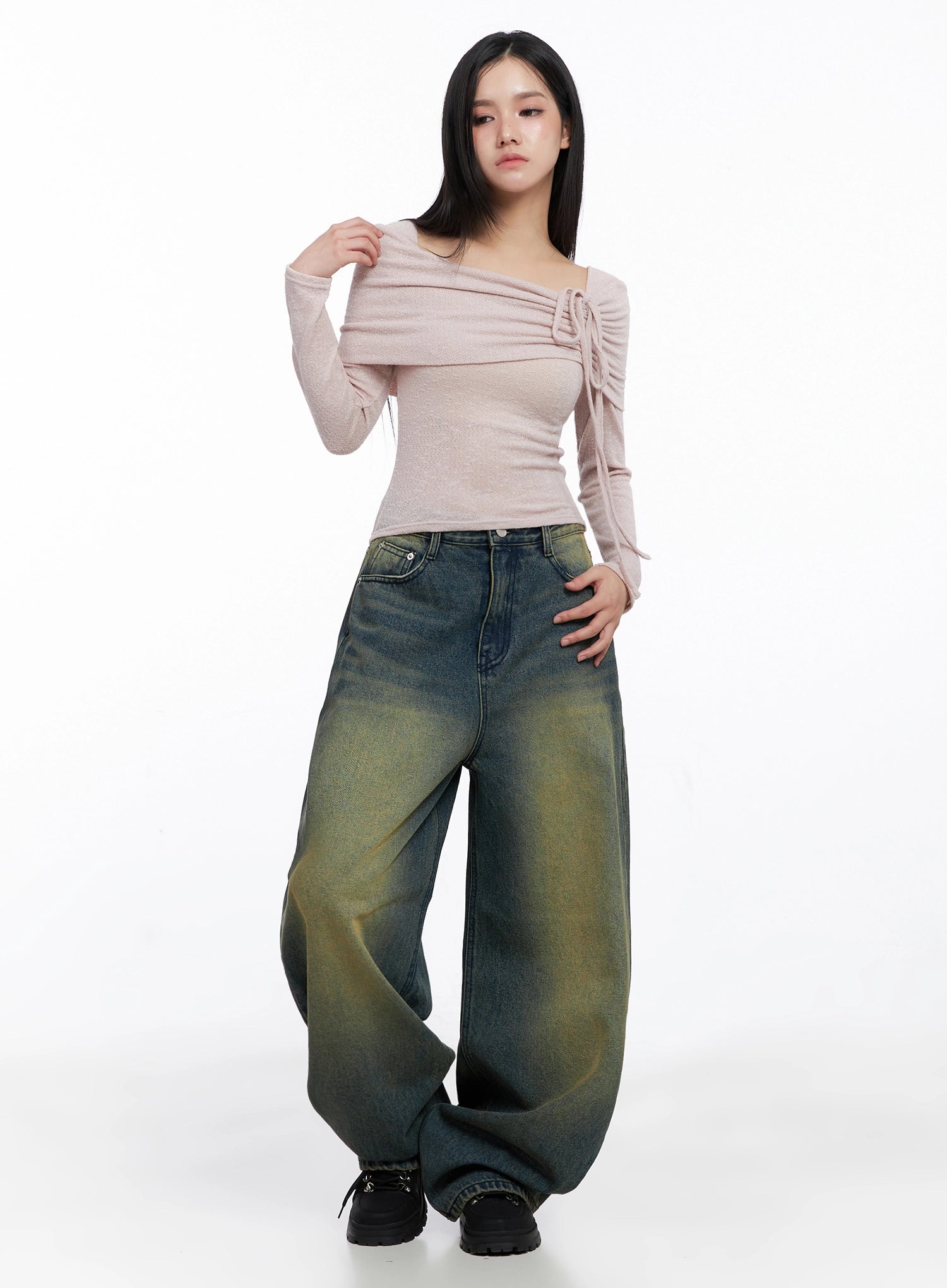 Elora Washed Baggy Jeans IS525 in dark blue, full-body front shot on model, washed wide-leg denim with green-yellow fade, paired with pink off-shoulder ribbed top, hand on hip pose.