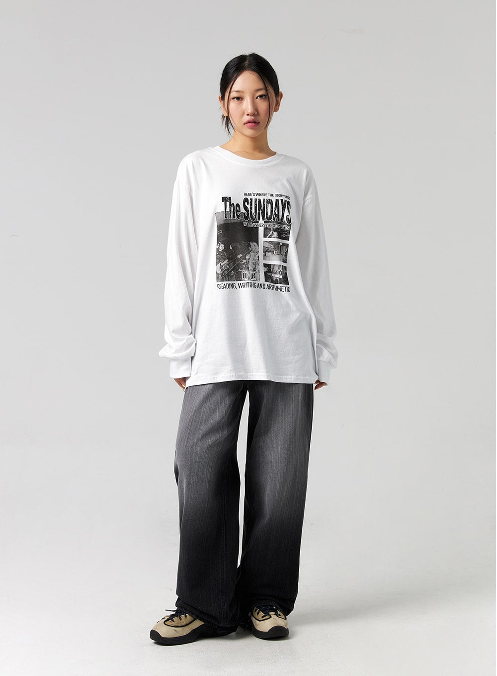 Washed Wide-Leg Jeans CG327 in black, front full-body shot on model with neutral pose, wide-leg washed cotton denim, high-rise fit, full-length hem, paired with oversized graphic long-sleeve tee.