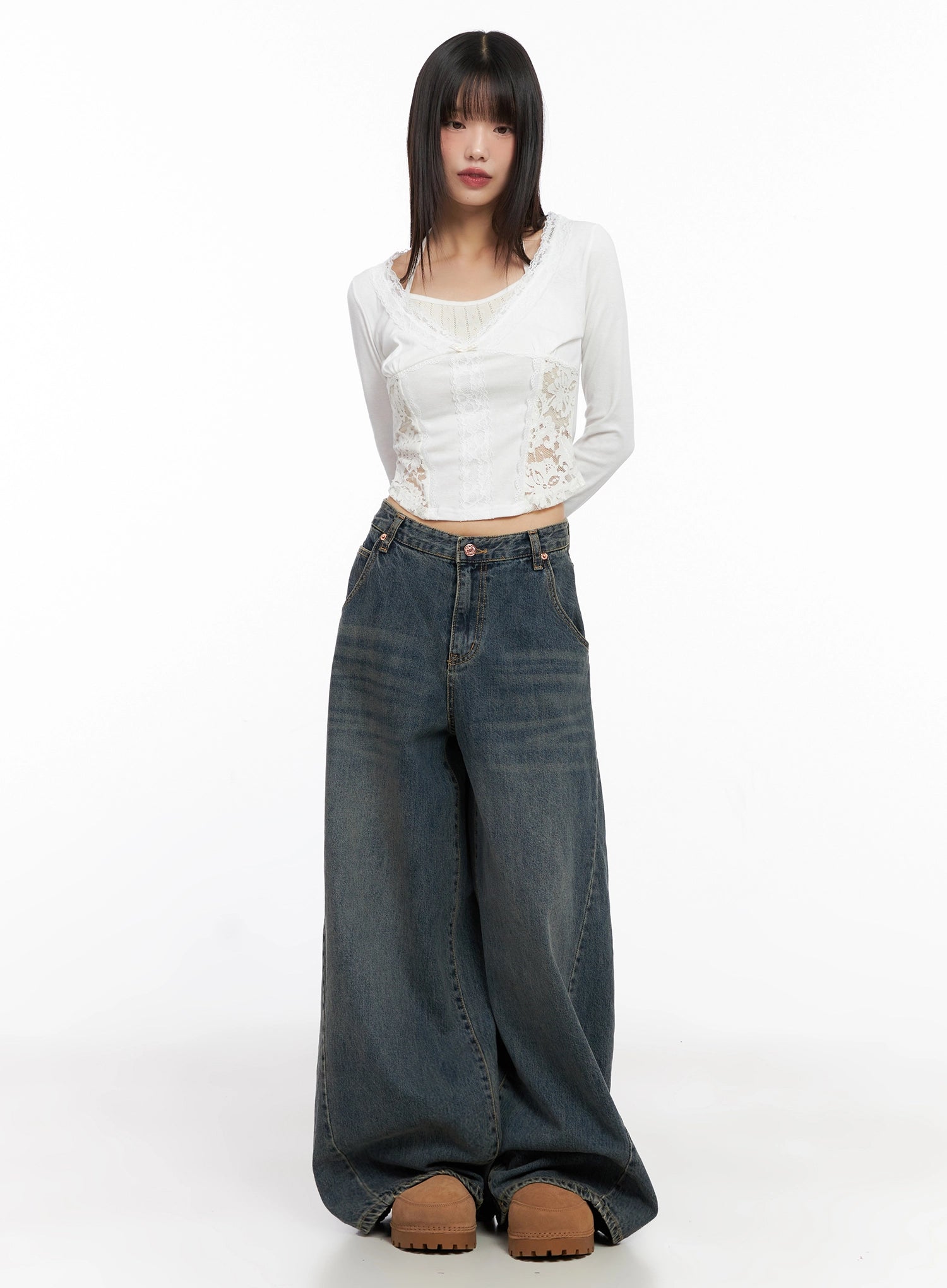 Skyler Washed Balloon Fit Jeans IN503 in blue, full-body front shot on model, paired with white lace corset top, extreme wide balloon leg in washed cotton, Acubi street styling.