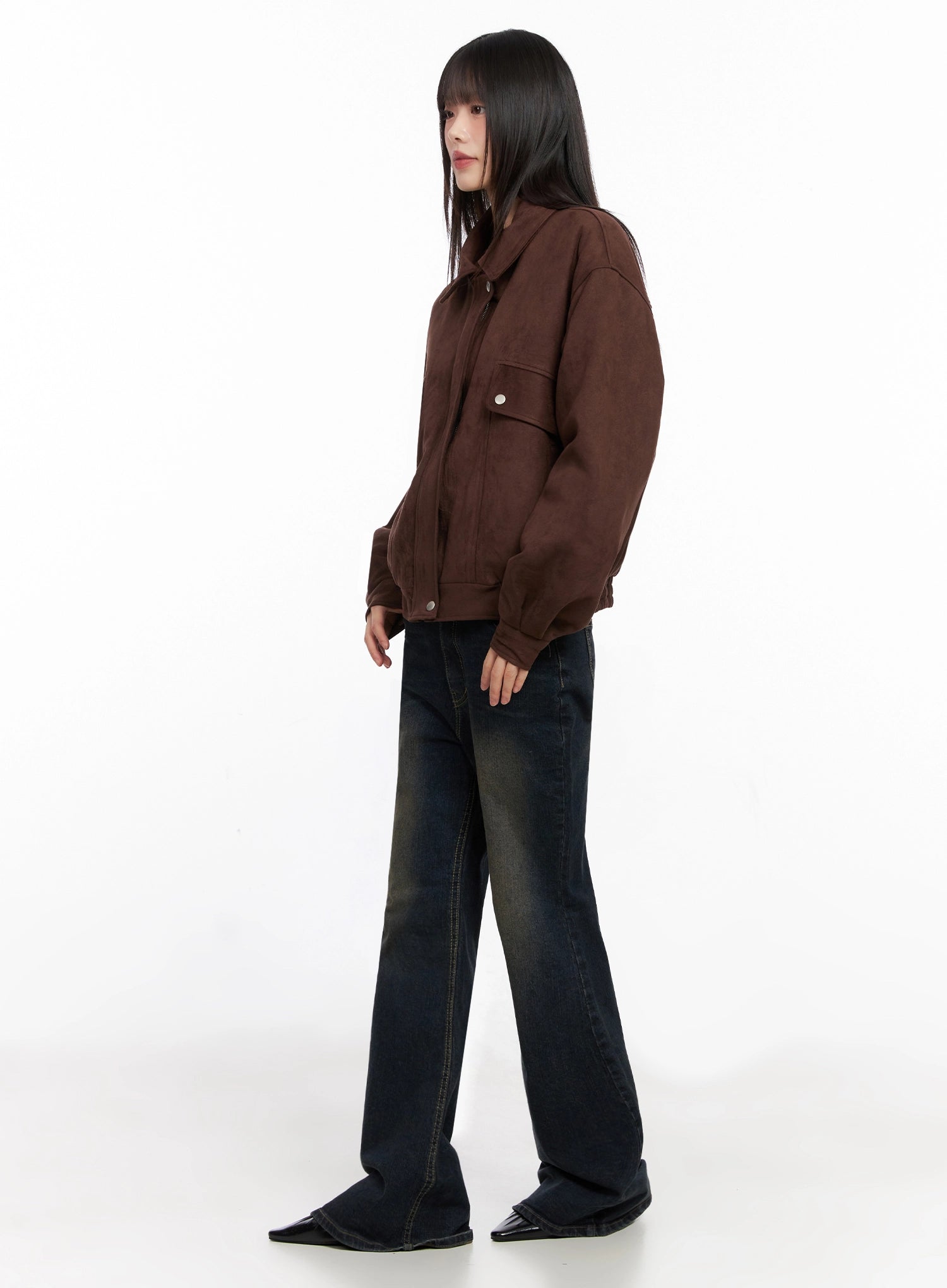 Lyanna Vintage Wash Bootcut Jeans IN503 in dark blue, full-body side styling shot, model in brown jacket turned sideways, long bootcut silhouette and vintage fading visible.