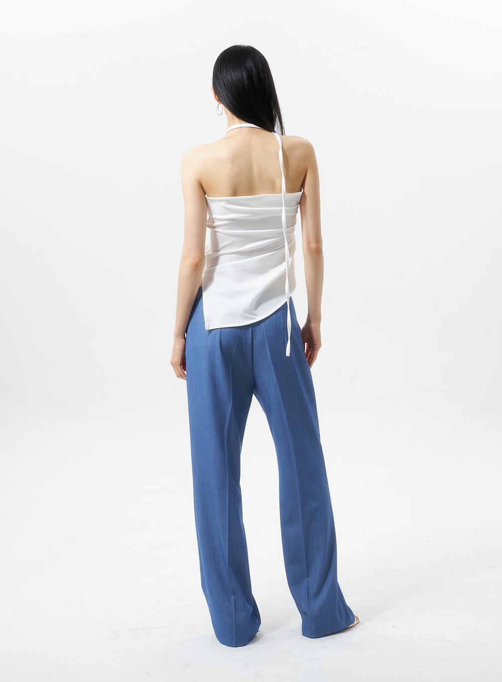 Low Rise Tailored Pants IU326 in blue, full-body back view on model, back seam and wide-leg hem shown, low-rise waistband, paired with white open-back halter top.
