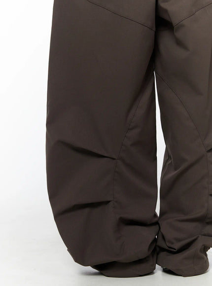 Wide Leg Pintuck Cargo Pants CU519 in dark brown, hem detail close-up, voluminous balloon leg with curved pintuck seam construction and gathered ruched hem at ankle.