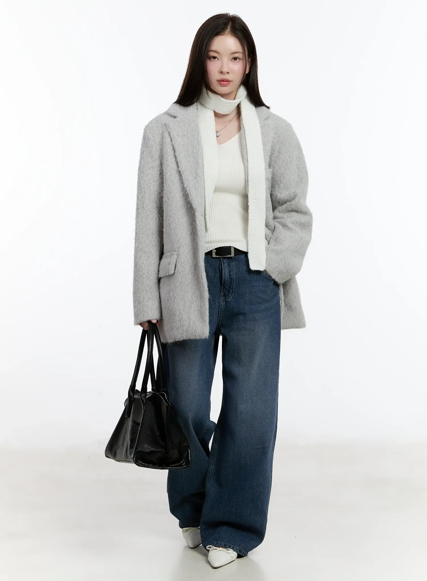 Della Casual Denim Wide Jeans ID511 in blue, full-body front shot on model, washed wide-leg cotton denim, long length, layered under grey fluffy coat with white scarf and black tote bag.