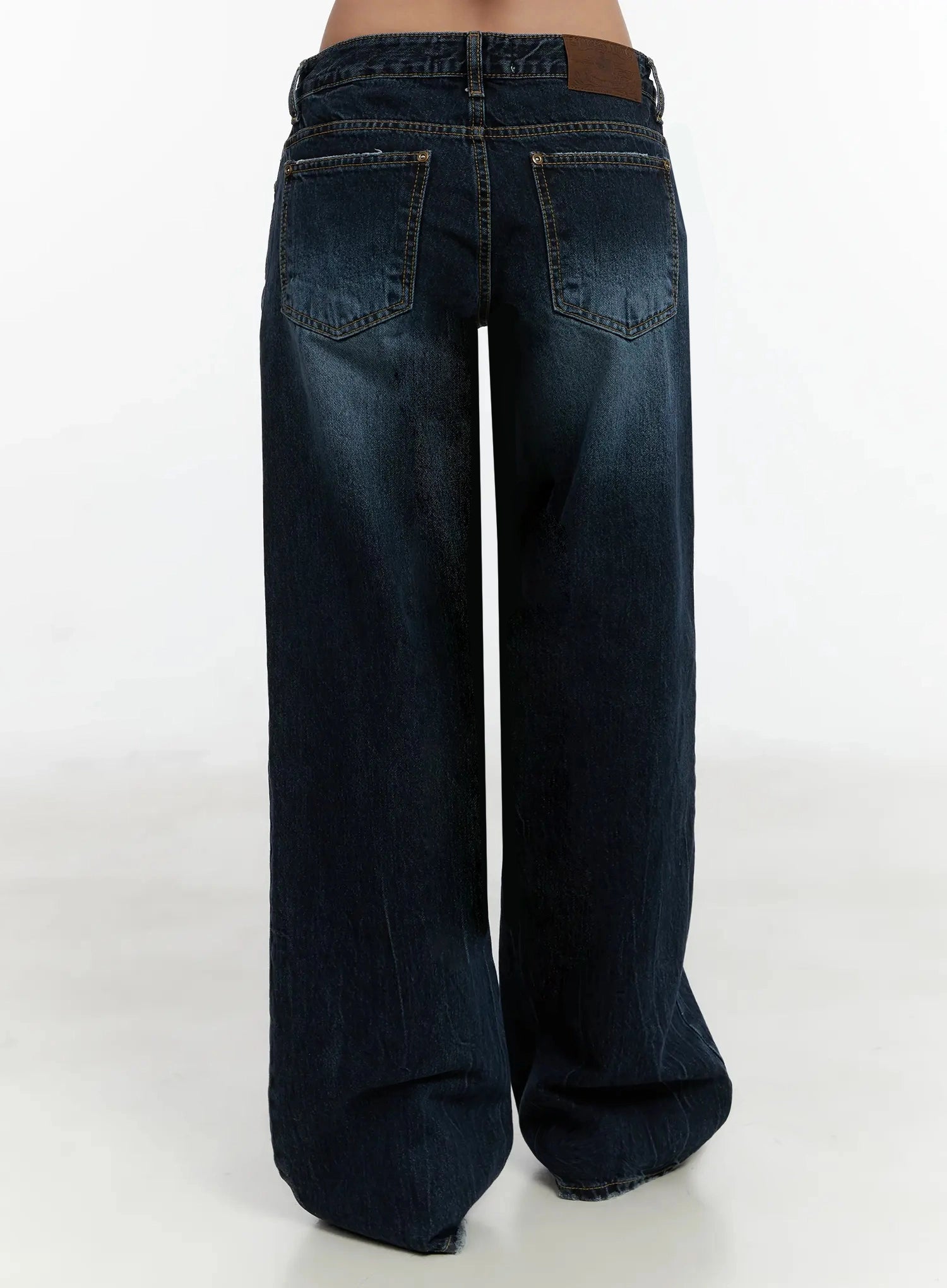 Aimee Low Rise Wide Leg Jeans ID525 in dark blue wash, back product shot from waist to hem on model, dual back pockets with gold contrast stitching and leather brand patch at waistband.