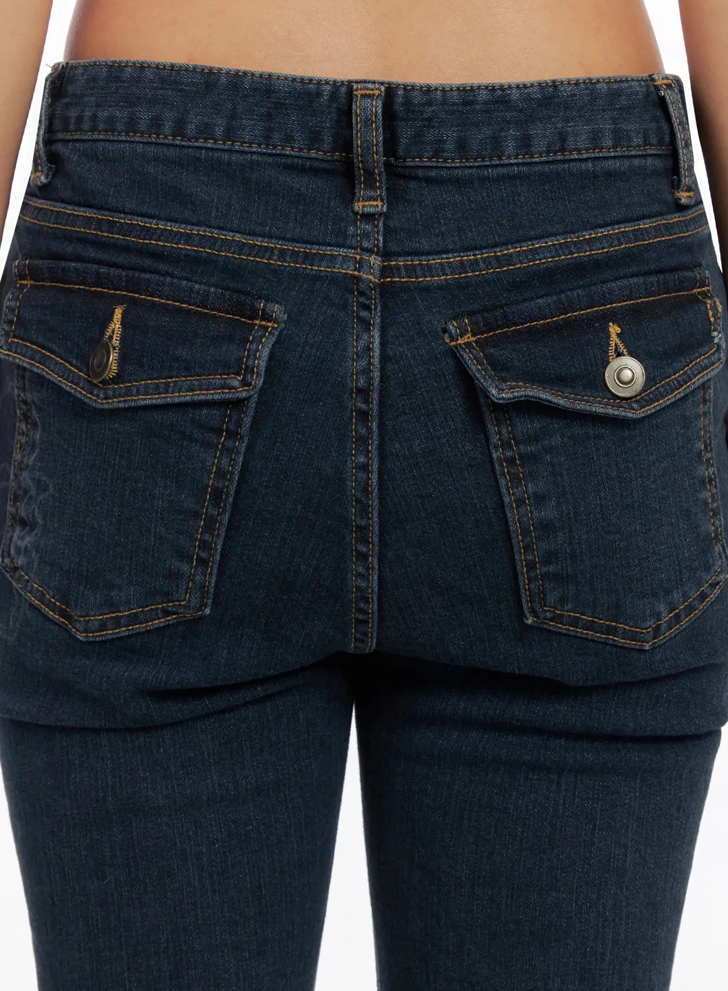 Amari Floral Embriodered Bootcut Jeans IN528 in dark blue, close-up detail of back waistband and pockets, dual flap pockets with gold zipper and snap button hardware, contrast amber topstitching on dark denim.