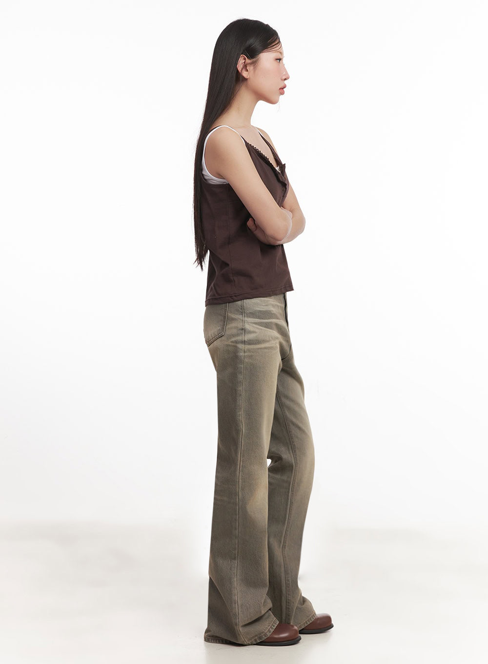 Sherry Washed Slim-Fit Bootcut Jeans IM528 in vintage brown, side full-length view on model with arms crossed, slim fit through hip and thigh with bootcut flare at ankle, brown cami styling.