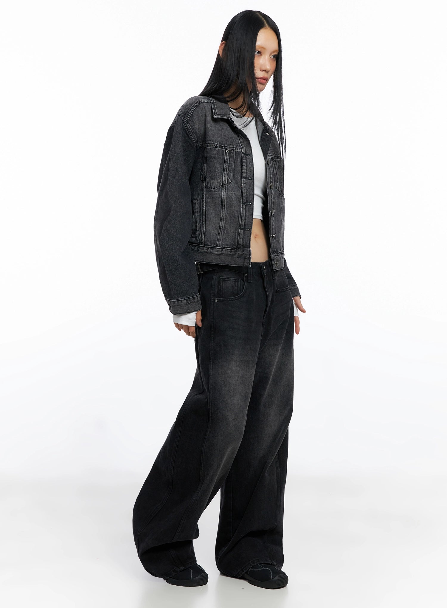 Goffel Side Belt Washed Wide Denim Pants IO517 in black, three-quarter side view on model, layered with washed black denim jacket, wide leg silhouette with belt detail visible.