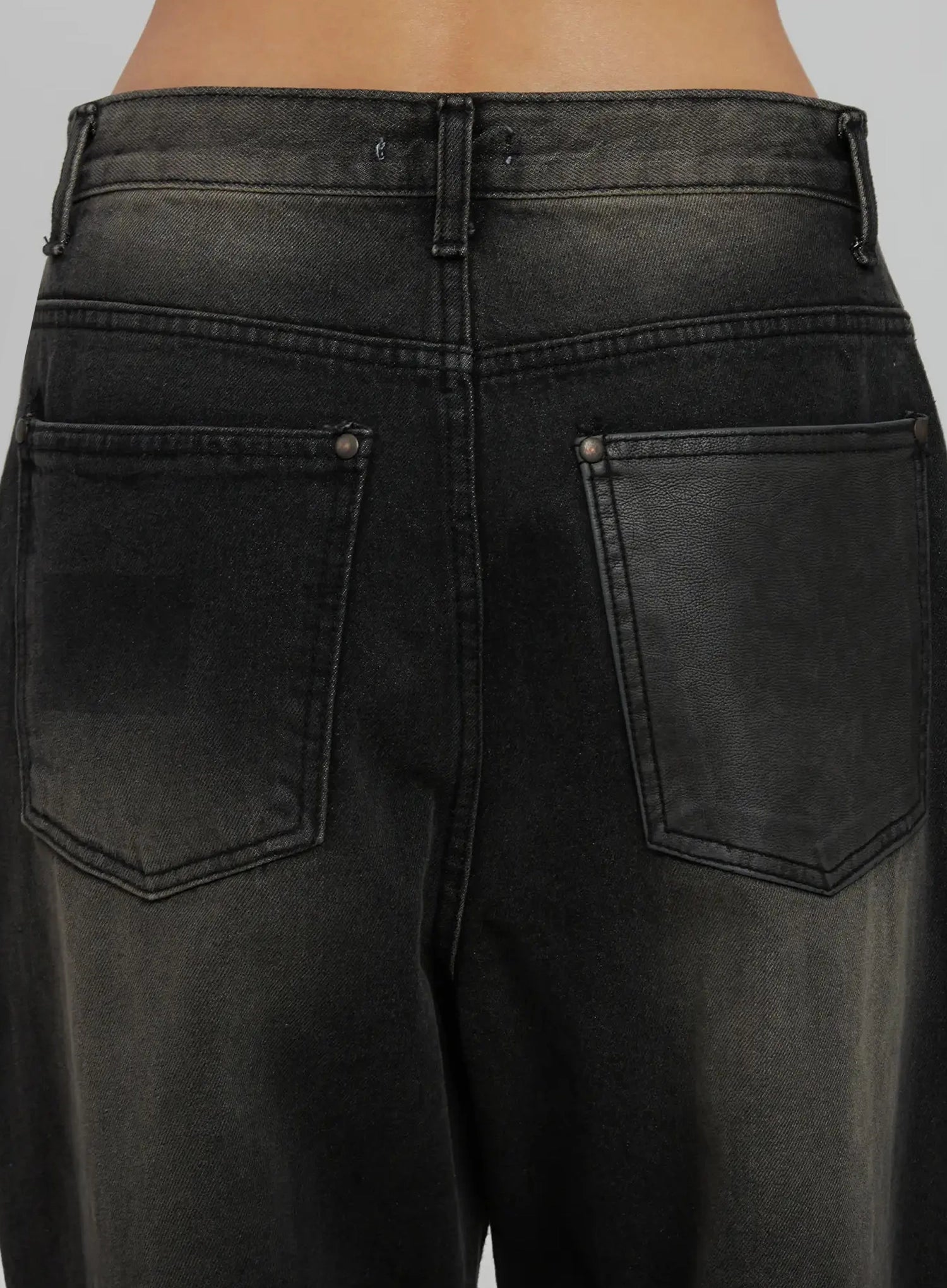 Blaire Dark Washed Wide Leg Jeans IJ509 in black, close-up back detail shot, dual patch pockets with rivet hardware, dark faded wash denim texture and rear waistband stitching clearly visible.