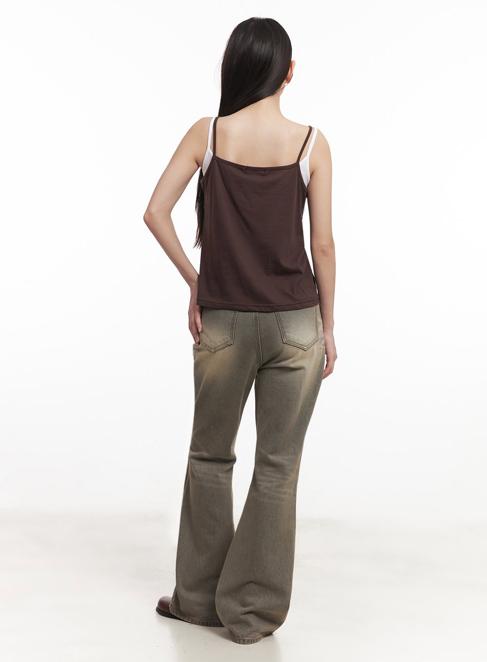 Sherry Washed Slim-Fit Bootcut Jeans IM528 in vintage brown, rear three-quarter full-length view on model, back pockets and bootcut flare visible, washed denim with warm brown tones, brown cami top.