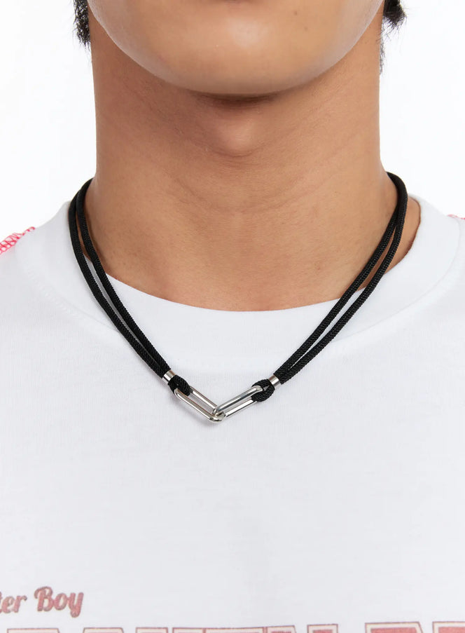 LEWKIN Bold Link Statement Chain Necklace IN528 in black, front close-up on male model, double-strand braided cord with interlocked silver carabiner link pendant, worn over white graphic tee.