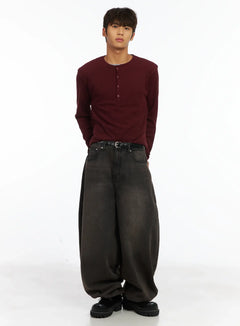 LEWKIN Men's Layered Waffle Henley Long Sleeve Shirt IJ514 in dark red, full-body front on model, waffle-knit texture, henley button placket, layered over grey tee, styled with oversized washed black jeans and chunky boots.
