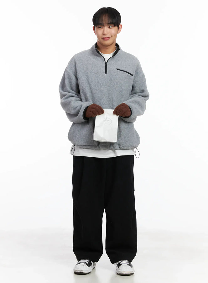LEWKIN Warm Fleece Quarterzip ID515 in gray (M/L), full-body front on model styled with brown gloves, white bag, and black wide-leg trousers, oversize fleece with quarter-zip collar and chest zip pocket.