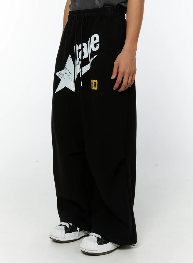 mens-graphic-parachute-string-sweatpants-black-iy513
