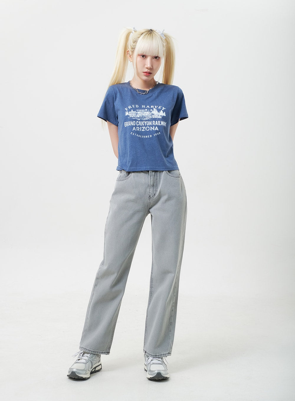 Straight Leg Jeans BU302 in gray, front standing shot on model, wide-fit washed cotton denim with banded waist, worn with blue graphic tee and silver sneakers.