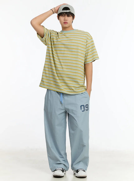 mens-09-graphic-nylon-drawstring-pants-im503 / Light blue