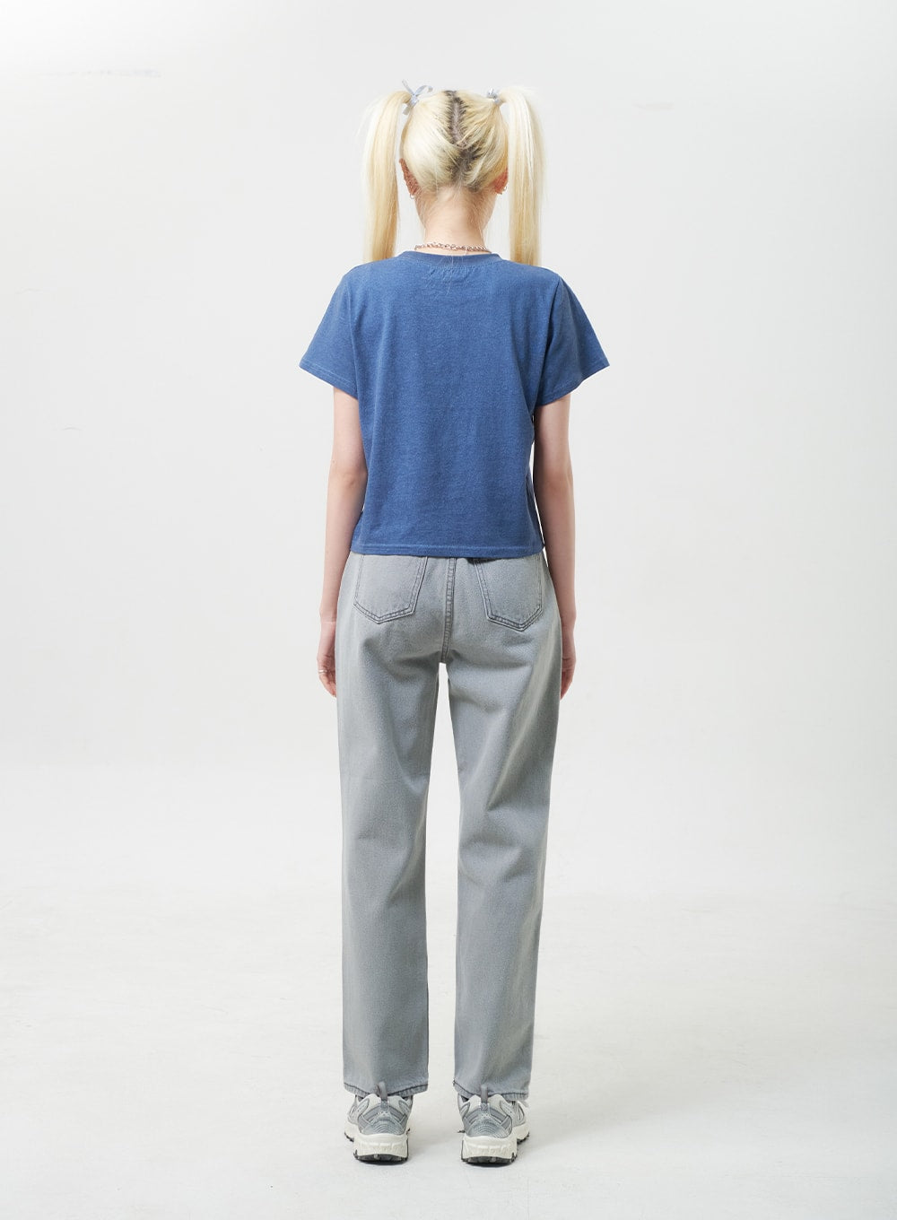 Straight Leg Jeans BU302 in gray, back full-body view on model, showing back patch pockets and straight wide leg, paired with blue tee and sneakers.