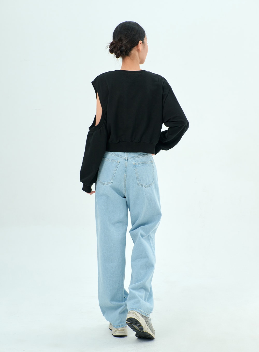 Ripped Basic Jeans BA328 in light blue, full-length back view on model, wide-fit cotton denim showing clean back pockets and relaxed leg, paired with black sweatshirt and sneakers.