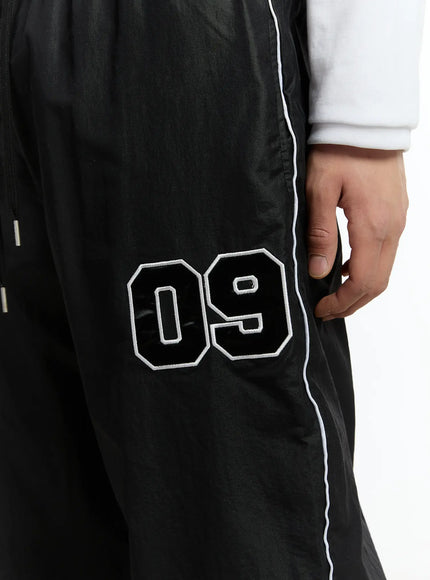 mens-09-graphic-nylon-drawstring-pants-im503