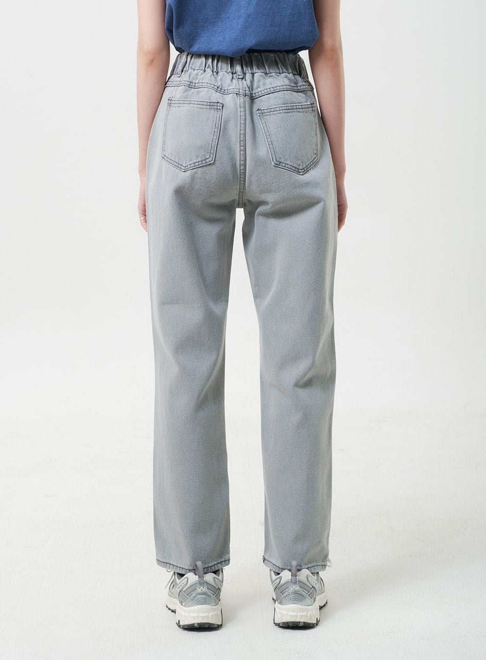 Straight Leg Jeans BU302 in gray, back waist-to-hem close-up on model, elastic banded waistband and twin back patch pockets, wide straight leg silhouette.