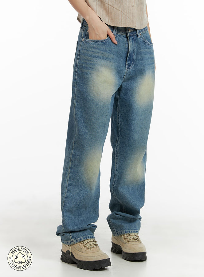 LEWKIN Recycled Washed Jeans (Unisex) CM425 in blue, front three-quarter shot on model, straight-fit cotton denim with vintage washed fading, styled with beige chunky sneakers.