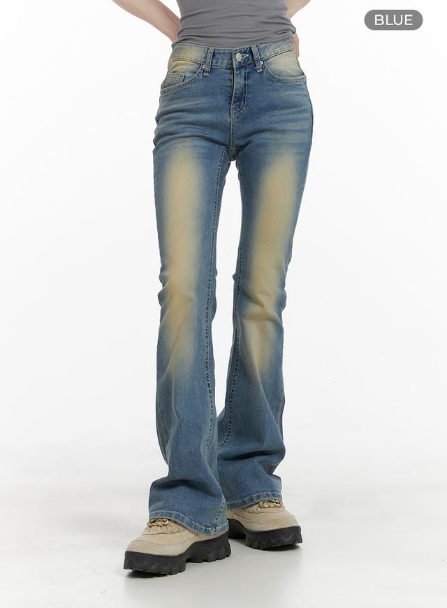 Slim Fit Washed Bootcut Jeans CA402 in blue, front mid-length view on model, color variant label visible, washed yellow gradient fade on thighs, slim waist with five-pocket construction.
