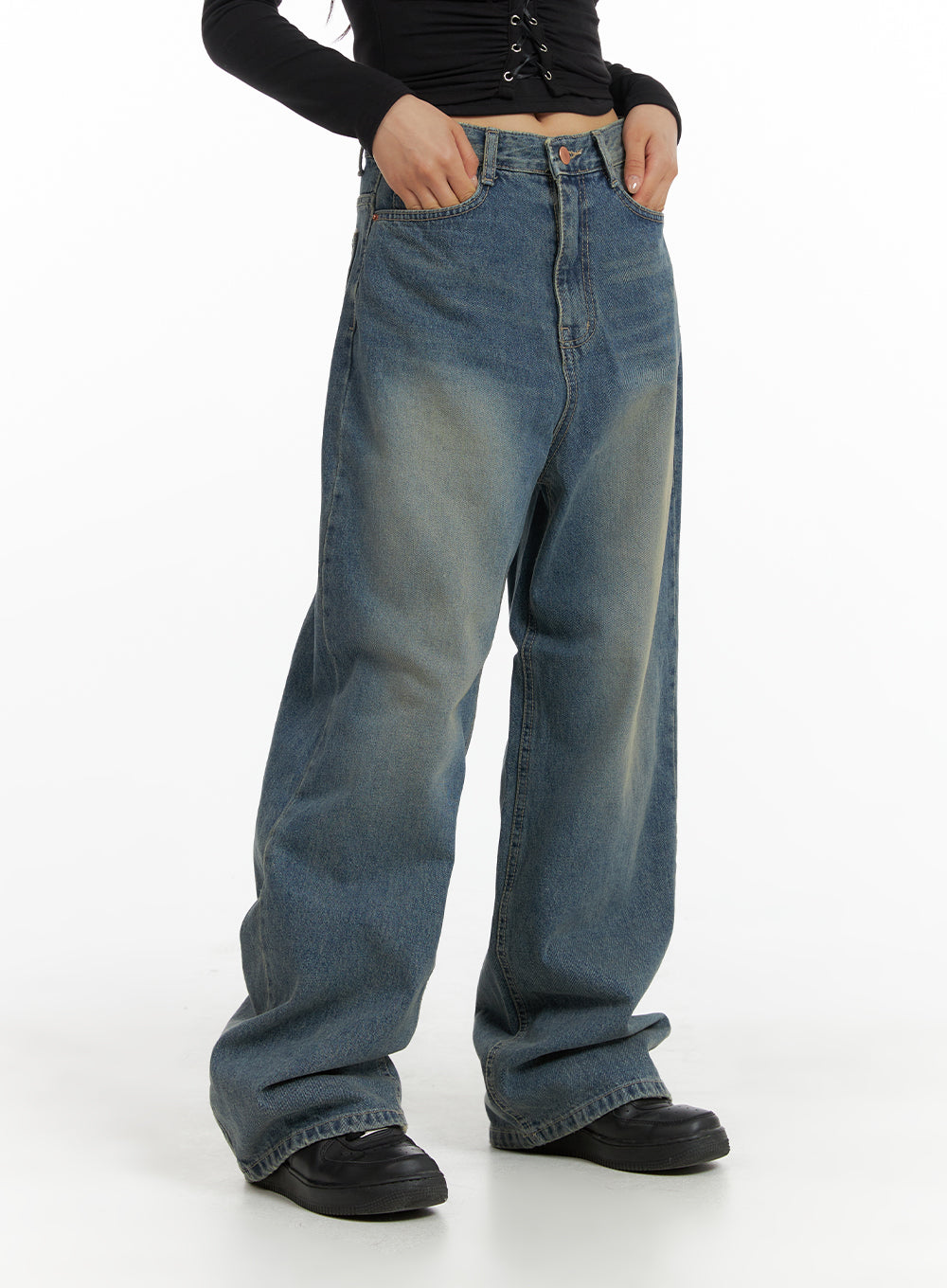 Solid Mid Waist Pocket Straight Leg Jeans IJ411 in washed blue, front view on model, mid-waist wide-leg denim with subtle whiskering, styled with black lace-up crop top and black loafers.
