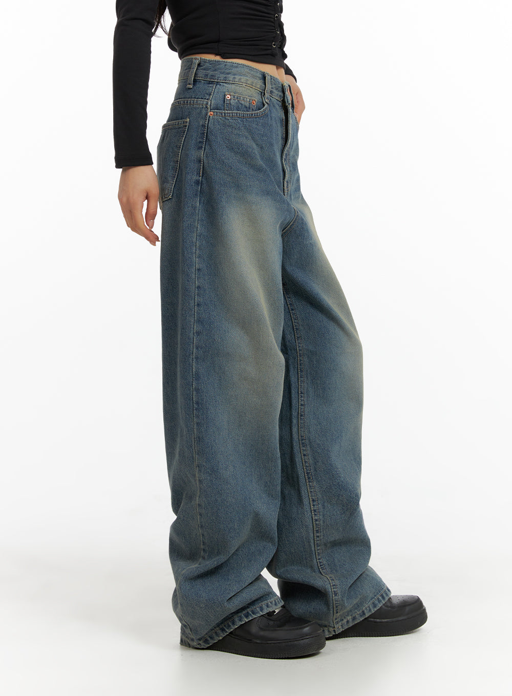 LEWKIN Solid Mid Waist Pocket Straight Leg Jeans IJ411 in washed blue, side view on model, wide-fit cotton denim with vintage fade, paired with black long-sleeve top and black loafers.