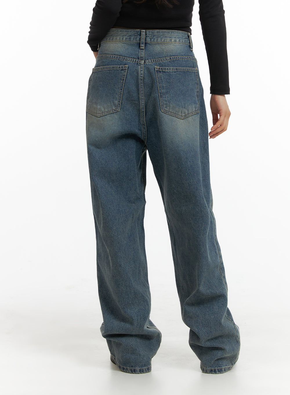 Solid Mid Waist Pocket Straight Leg Jeans IJ411 in washed blue, back view on model, featuring two back patch pockets and wide-leg silhouette, paired with black long-sleeve top.