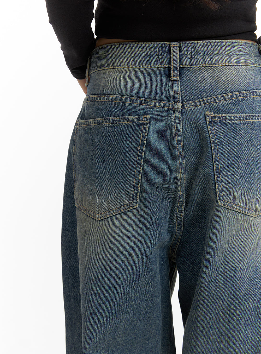 Solid Mid Waist Pocket Straight Leg Jeans IJ411 in washed blue, macro back close-up on model, showing back patch pockets, contrast topstitching and washed denim surface detail.