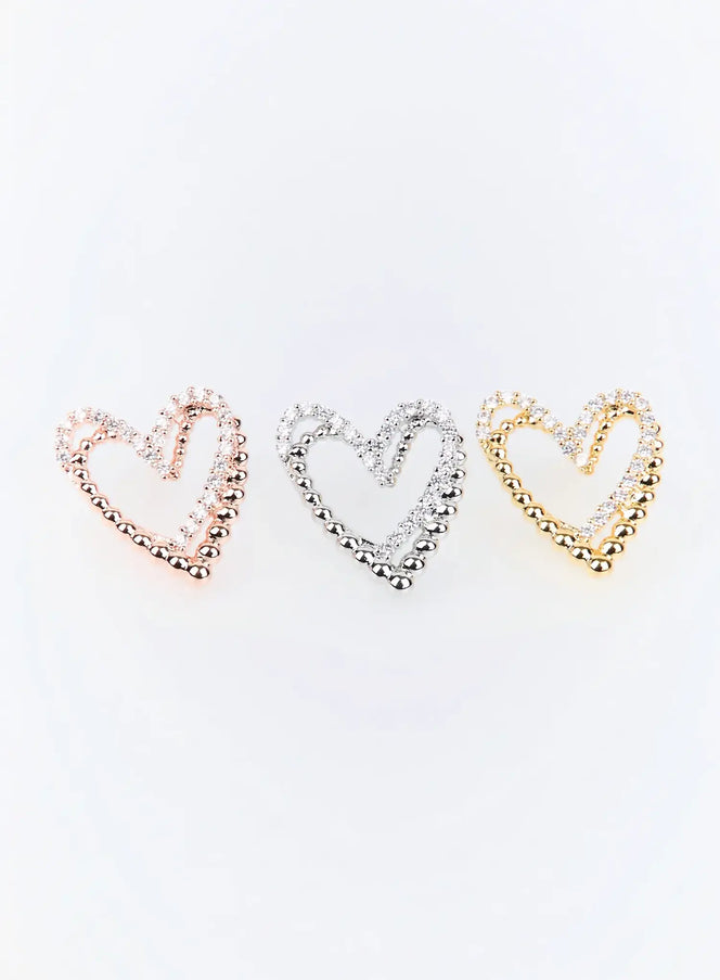 Julian Earring IU503 flat lay showing all three colorways — rose gold, silver, and gold — open heart stud with dual bead-and-crystal border detail.