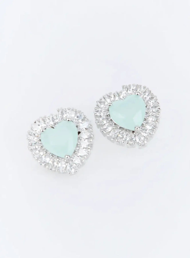 Fellini Earring IU503 in mint, flat product shot of pair, heart bead center with crystal baguette halo, silver-tone feminine stud design.