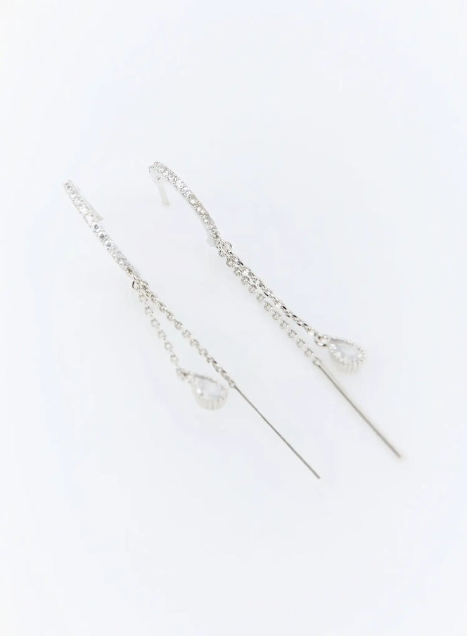 Gideon Earring IU503 in silver, flat product shot of pair, pave crystal arc top, double link-chain drop, teardrop CZ charm and long needle bar visible.