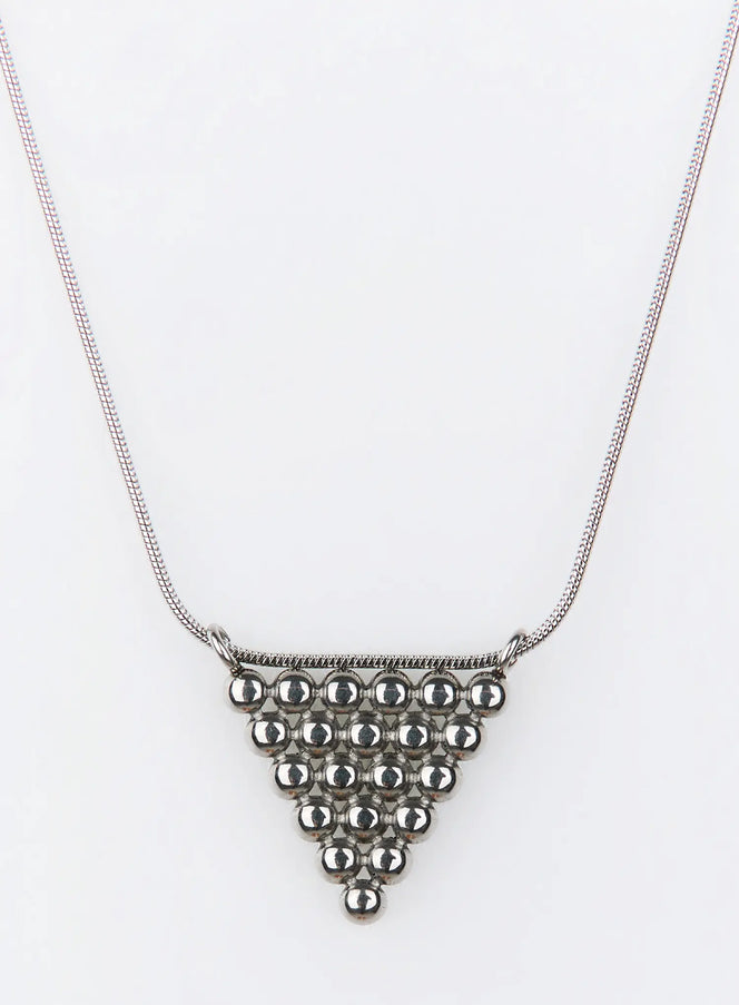 Klimt Necklace IU503 in silver, flat product shot, triangular bead pendant on snake chain, stacked spherical beads forming geometric pyramid detail.