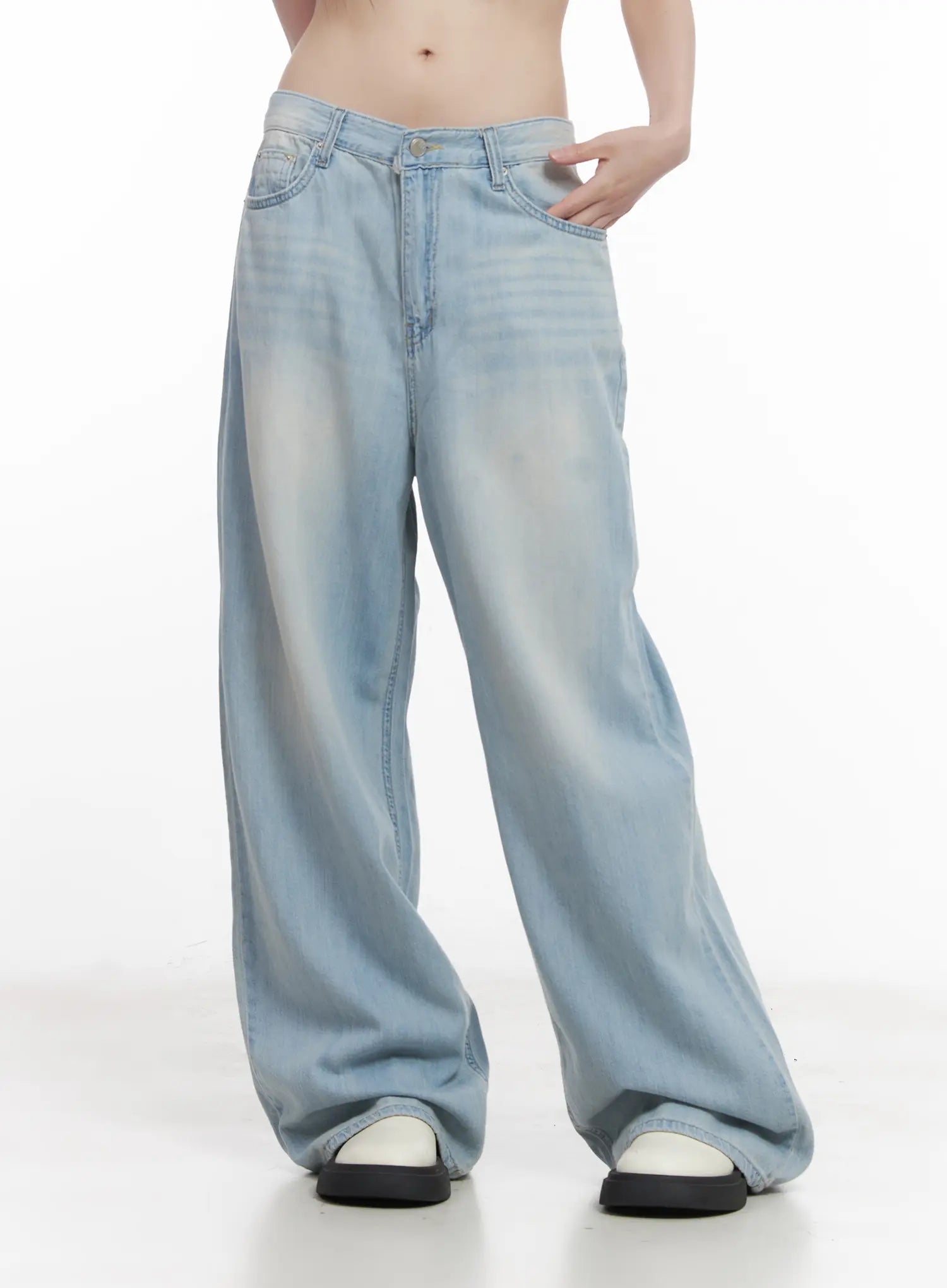 Garam Washed Wide-Leg Jeans CU518 in light blue, front waist-to-hem close-up on model, low-rise button closure, washed fade gradient, voluminous wide-leg cotton denim.