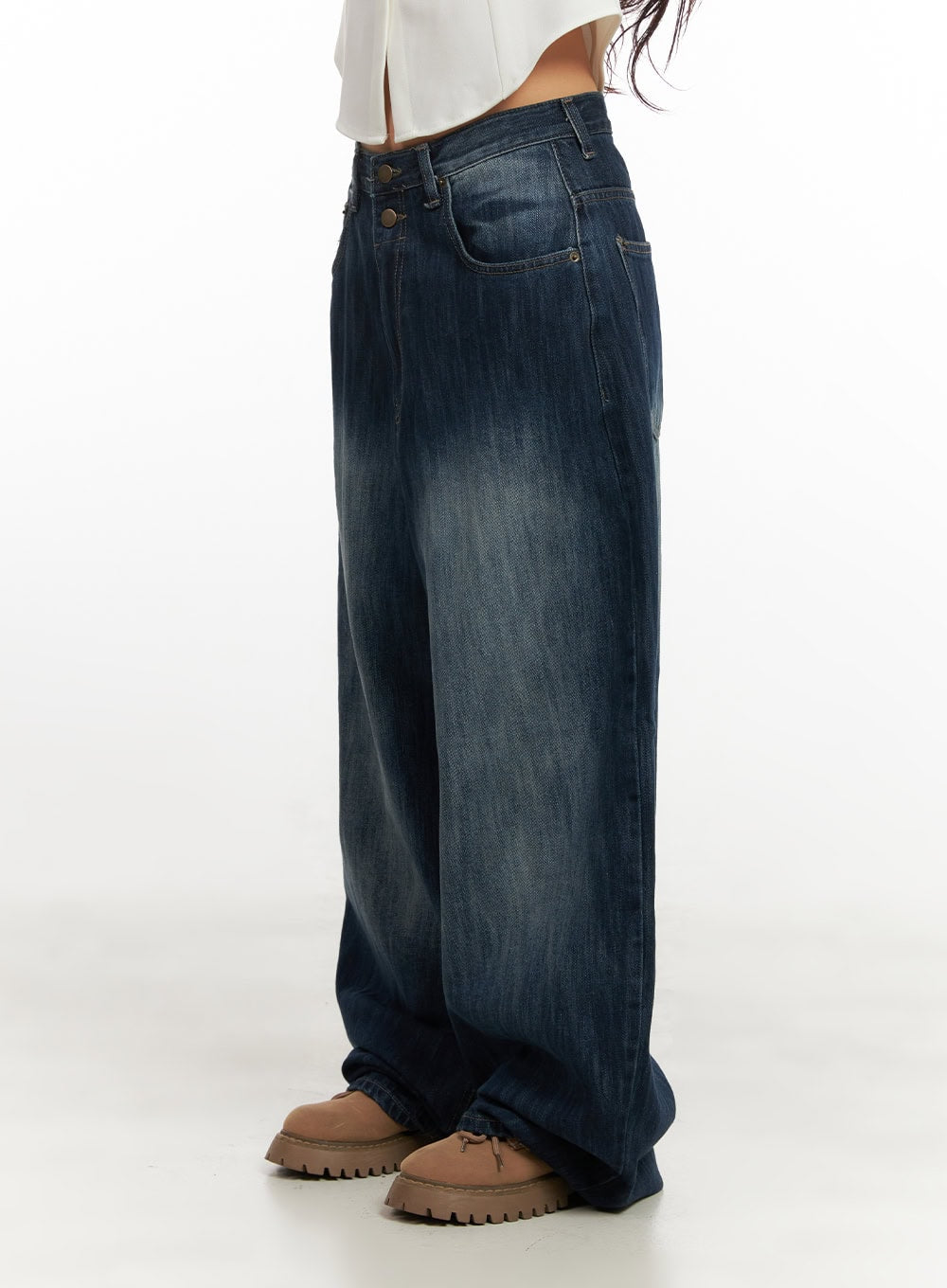 Jessica Wide-Fit Denim Jeans CN426 in blue, side-view waist-down shot on model, highlighting double-button waistband, deep indigo washed denim, exaggerated wide leg stacking over chunky loafers.