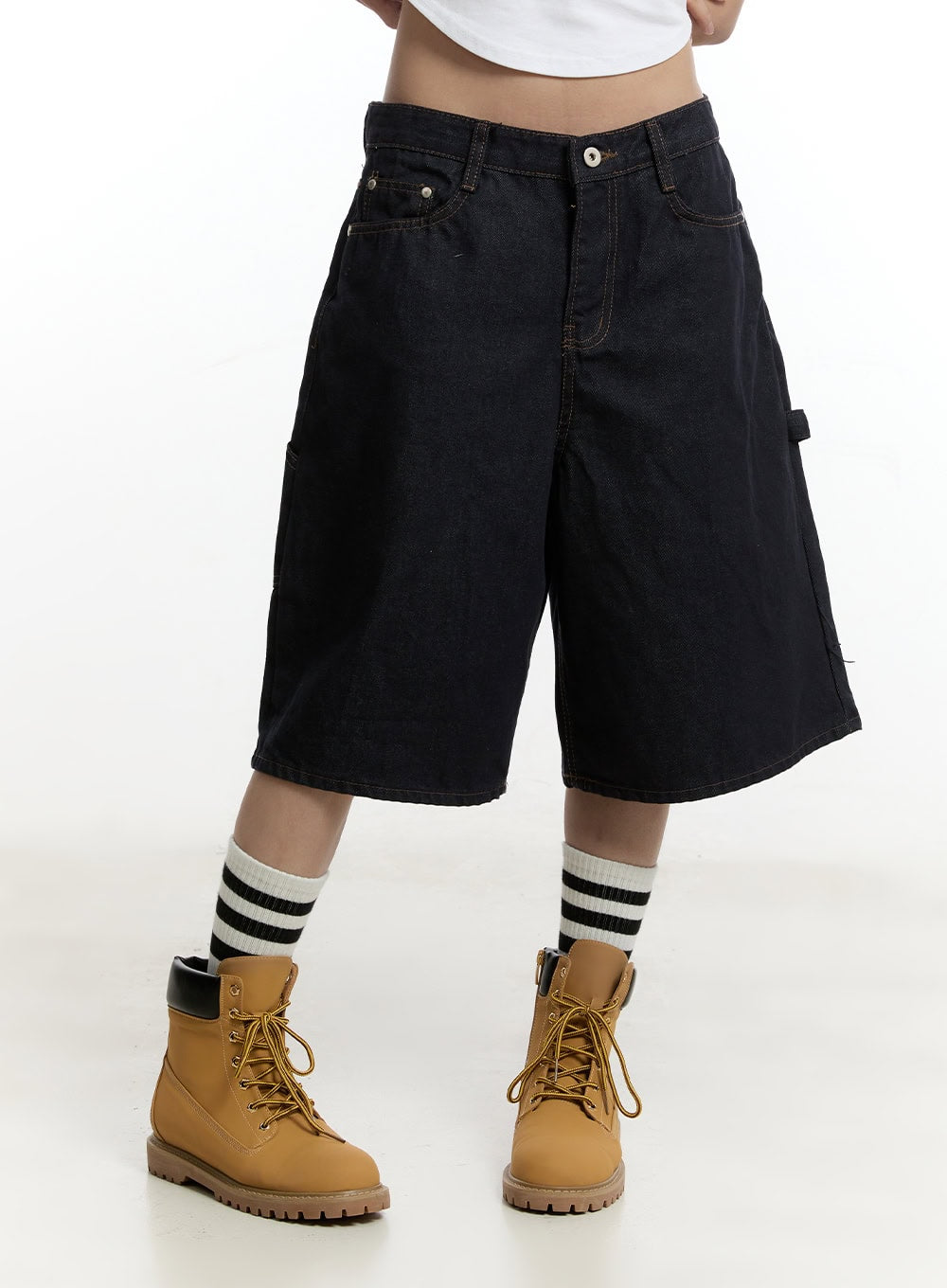 Carpenter Denim Wide-Leg Jorts CY501 in dark blue, front waist-down close-up on model, five-pocket layout with coin pocket and contrast stitching on wide-leg cotton denim, tan boots styling.