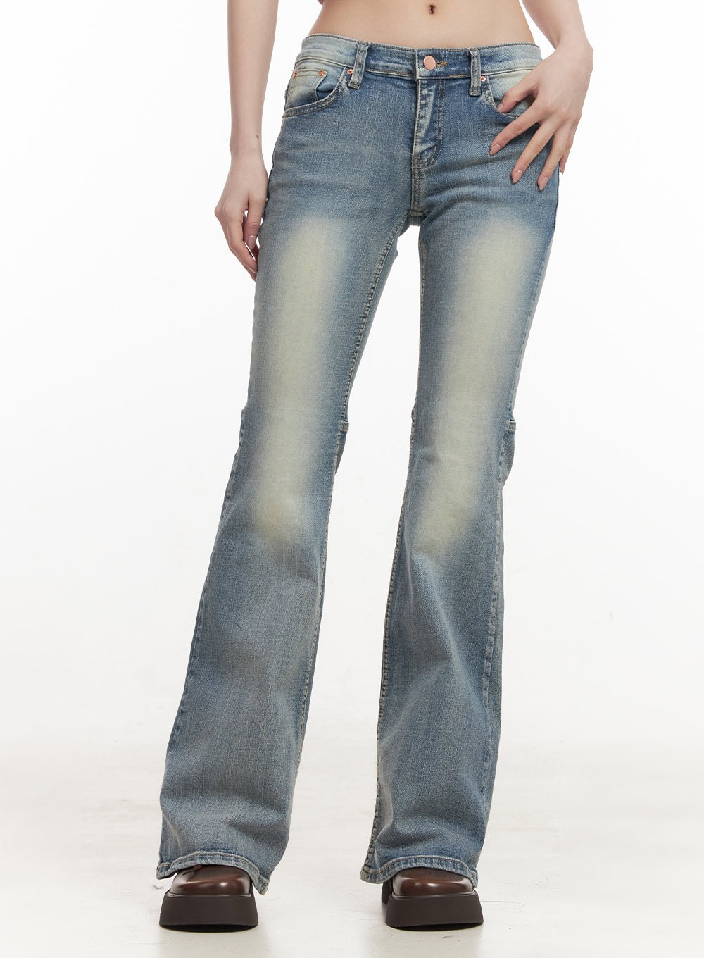 Tracy Washed Bootcut Jeans CF513 in light blue, front close-up waist-to-ankle on model, highlighting low-rise waistband, washed sun-faded finish, slim thigh, and bootcut flare.