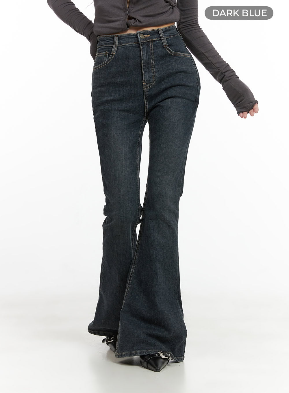 Zadie Slim Washed Denim Bootcut Jeans CG421 in dark blue, front three-quarter view on model with color label, slim high-rise waist tapering into flared bootcut hem, washed denim with contrast topstitching.