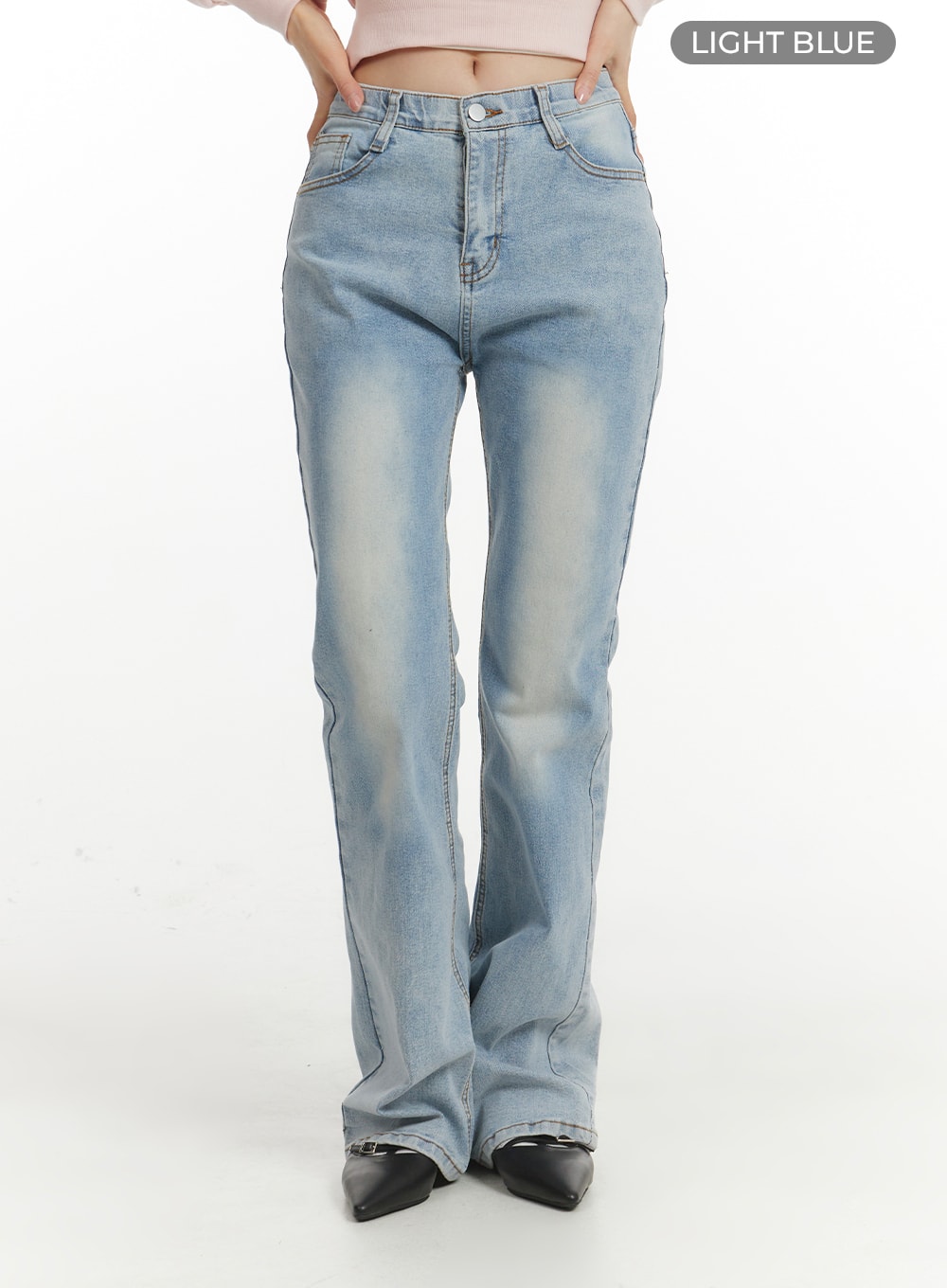 Light Washed Bootcut Jeans OF427 in light blue, front product-focus shot on model, high-waist fit with faded wash gradient, slim through thigh flaring to bootcut, button and zip fly.