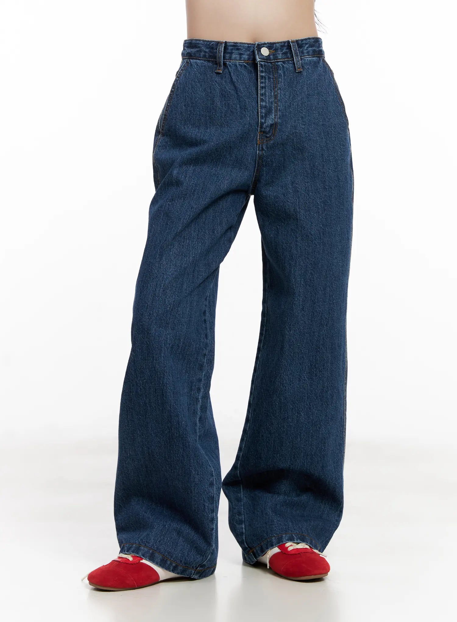 Ahyeon Classic Relaxed-Fit Denim Jeans CL515 in dark blue, front three-quarter view on model, high-waist wide-leg cotton denim, hem grazes red flats.