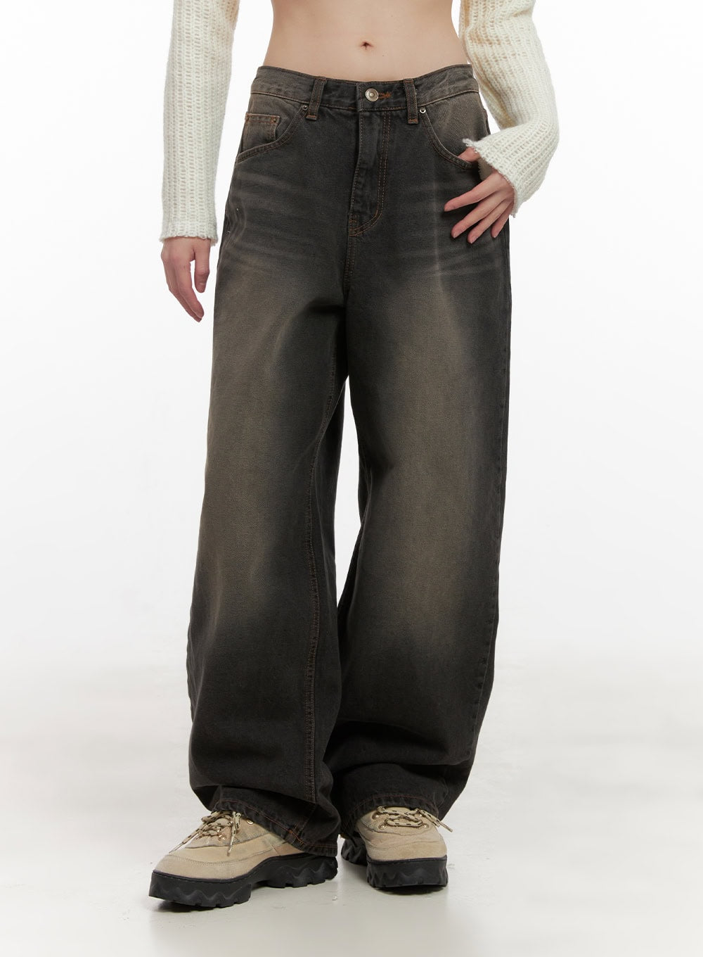 Celina Washed Baggy Wide-Leg Jeans CD426 in black, front waist-down close-up on model, low-rise button fly with washed faded denim, roomy baggy wide-leg cut, paired with cream knit crop and lug sneakers.
