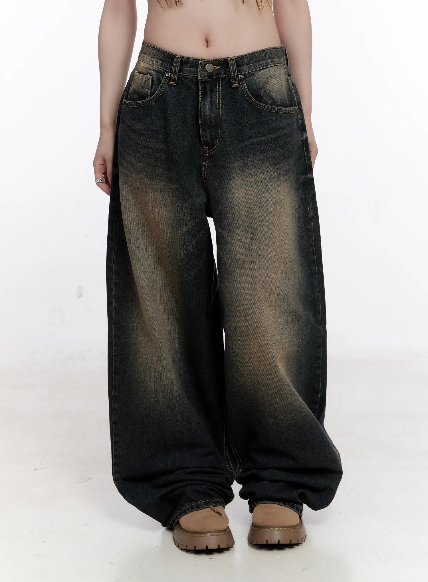 Sylvia Vintage Washed Baggy Jeans CO501 in dark blue, front mid-shot on model, emphasizing the voluminous oversize leg, warm amber wash gradient on cotton denim, front pockets, and gathered hem.