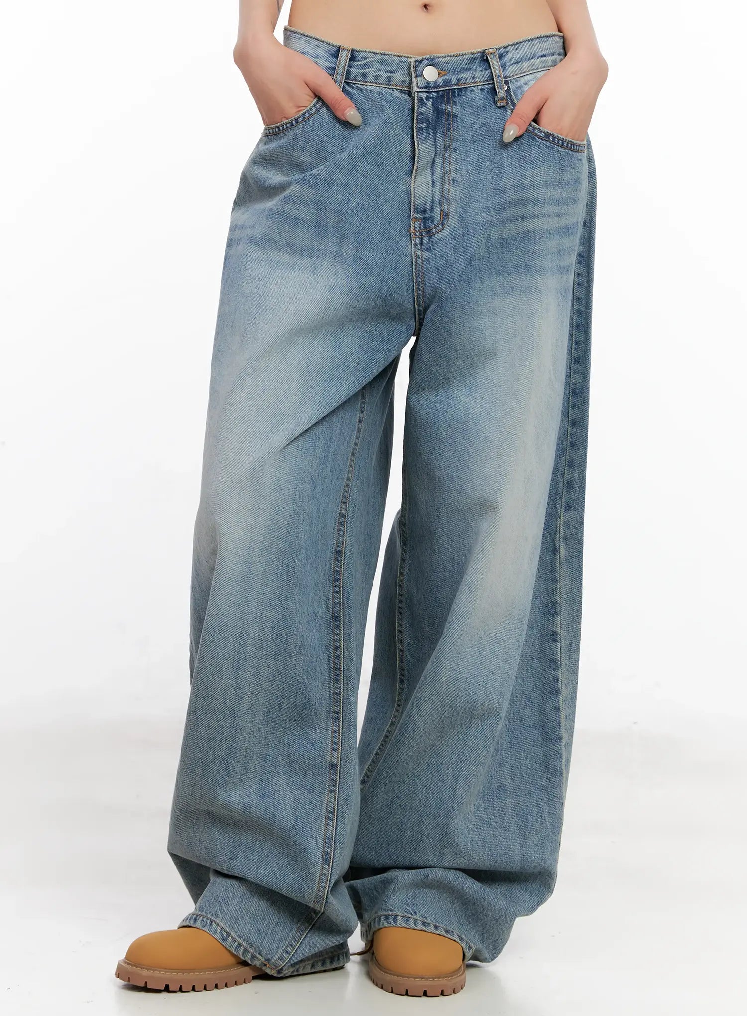 Koko Vintage-Wash Baggy Jeans CL528 in blue, front mid-length on model with hands in pockets, emphasizing wide baggy fit and vintage-wash cotton fabric texture.