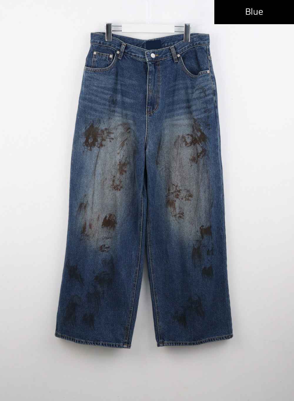 Street-Style Wide Fit Washed Jeans CO323 in Blue, flat hanger product shot, wide leg silhouette with five-pocket construction and all-over brown washed stain pattern on cotton denim.