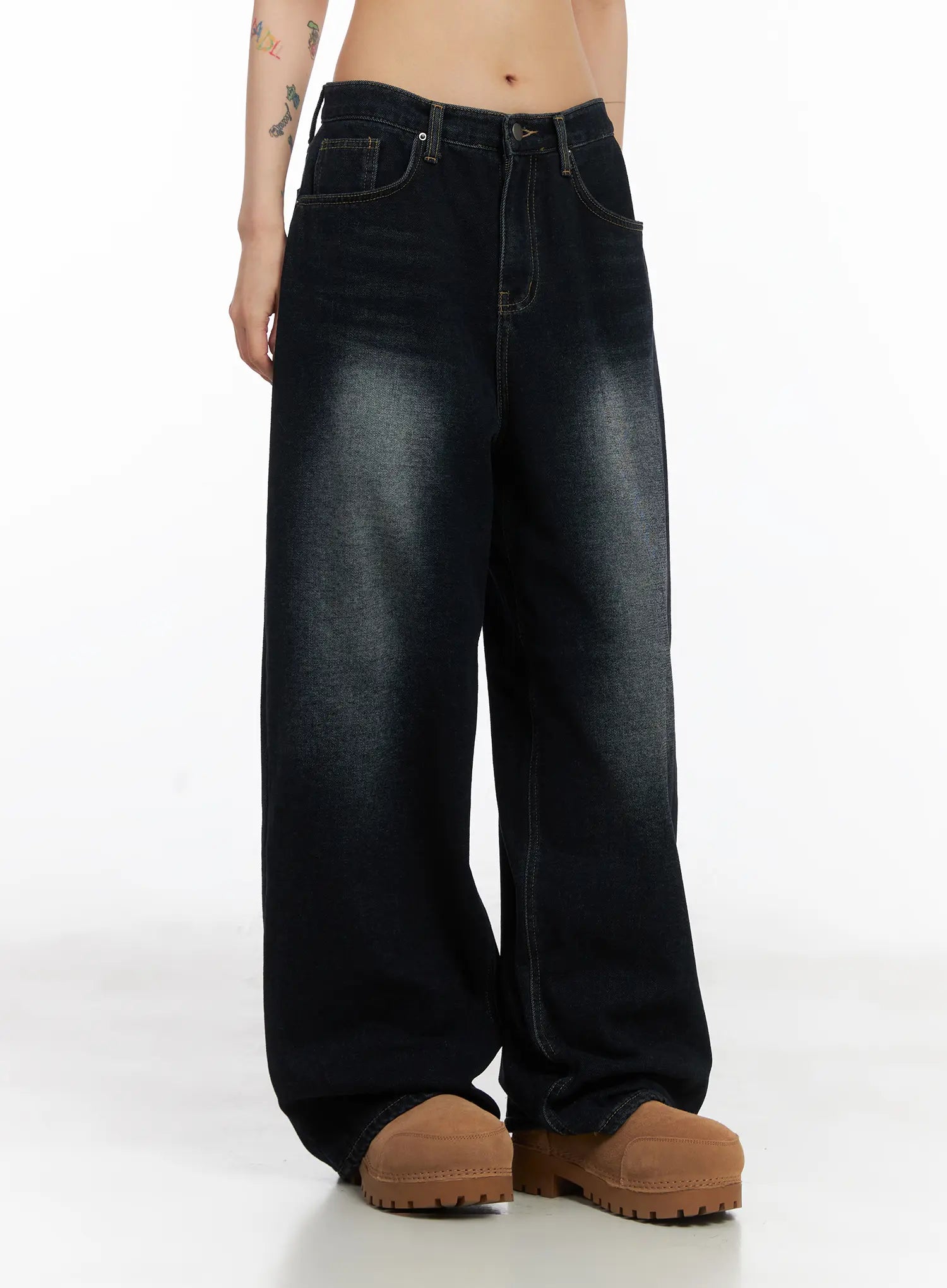 Soph Fleece-Lined Washed Wide-Leg Jeans CD509 in dark washed indigo, front three-quarter view on model, showcasing long wide-leg length, faded indigo wash, and front pockets with gold topstitching.
