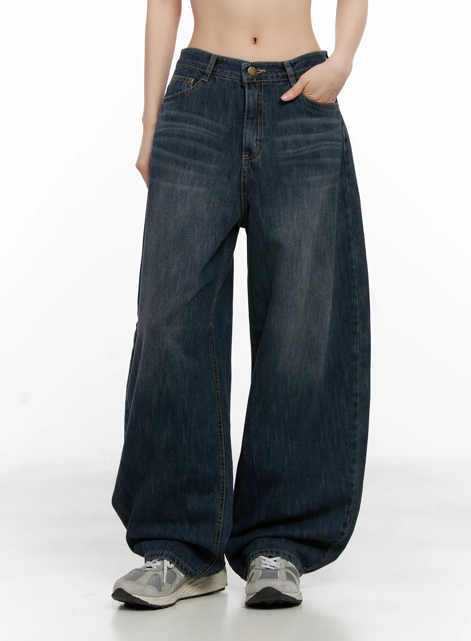 Seoy Washed Denim Jeans CG525 in dark blue, front mid-shot on model with hand in pocket, wide balloon leg and washed cotton denim fading detail clearly visible.
