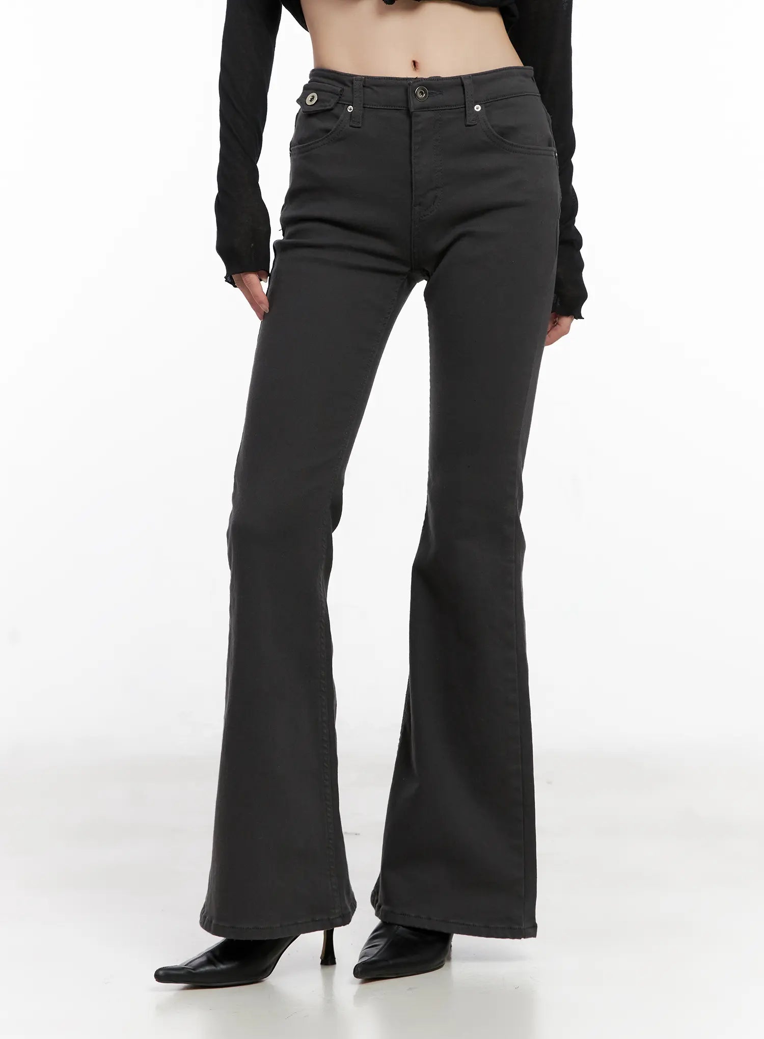 Addie Chic Flared Jeans CG522 in dark gray, front lower-body view on model, slim fit through thigh flaring to wide bootcut hem, mid-rise with front pockets, worn with black heels.