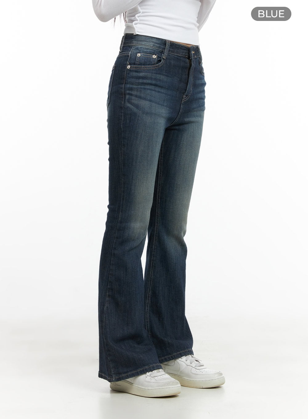 Remy Washed Bootcut Jeans CG420 in blue, side product shot on model showing full length, slim fit washed denim with gradual bootcut flare from knee to hem, sneakers at base.