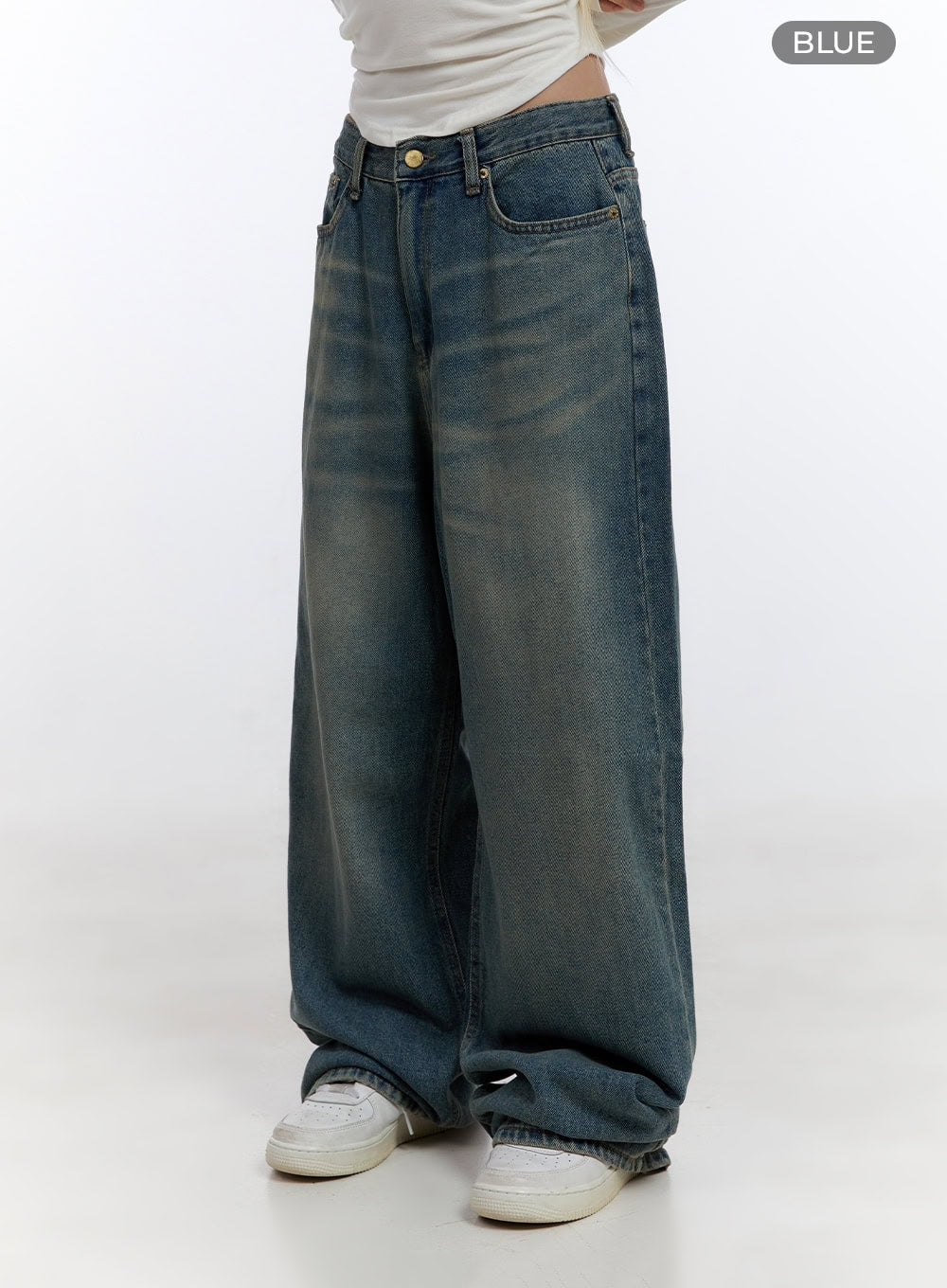 Zola Casual Fit Denim Jeans CO422 in blue, side product shot on model, color swatch label visible, wide-fit washed denim with gold hardware, mid-rise waist, and floor-length leg.